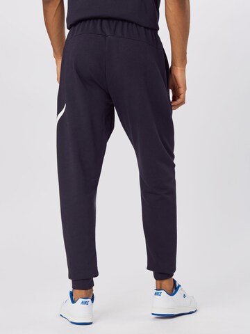 Effilé Pantalon de sport NIKE en noir