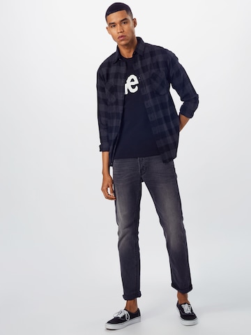 Lee جينز مضبوط قميص 'Wobbly Logo Tee' بلون أسود