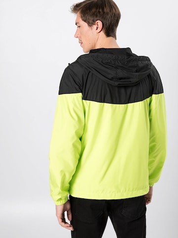 Veste mi-saison Urban Classics en jaune : derrière