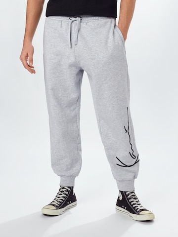 Karl Kani Tapered Pants in Grey: front