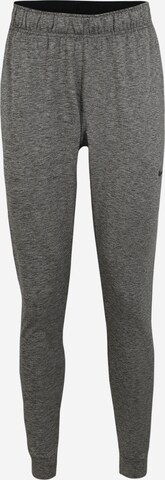 Pantalon de sport NIKE en gris : devant