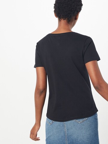 Tricou de la Tommy Jeans pe negru: spate