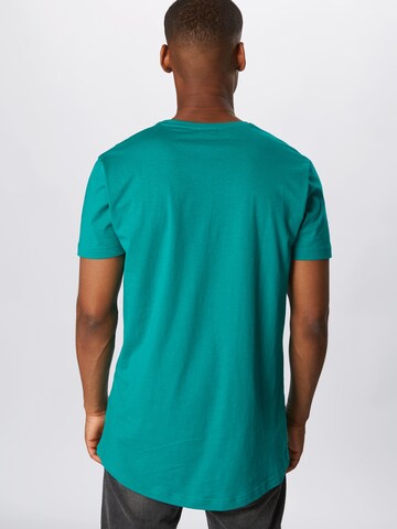 T-Shirt Urban Classics en vert : derrière