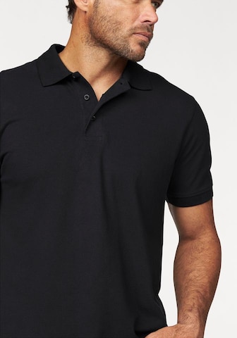 Man's World Poloshirt in Schwarz