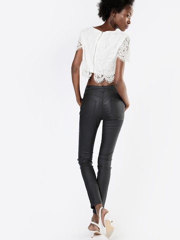 Coupe slim Pantalon heine en noir : derrière