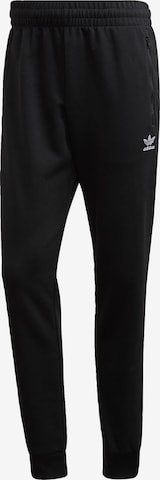 Effilé Pantalon ADIDAS ORIGINALS en noir : devant