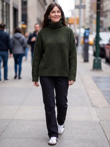 Green Sweater Black Jeans Look