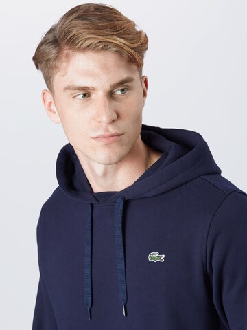 LACOSTE Sweatshirt i blå