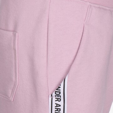 Loosefit Pantalon de sport UNDER ARMOUR en rose