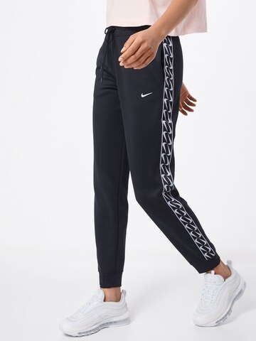 Regular Pantaloni de la Nike Sportswear pe negru: față