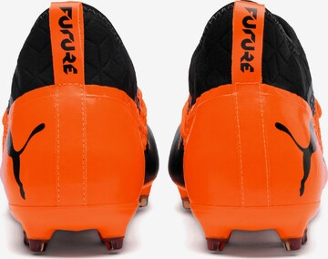 Chaussure de foot 'Future 2.3 Netfit' PUMA en orange