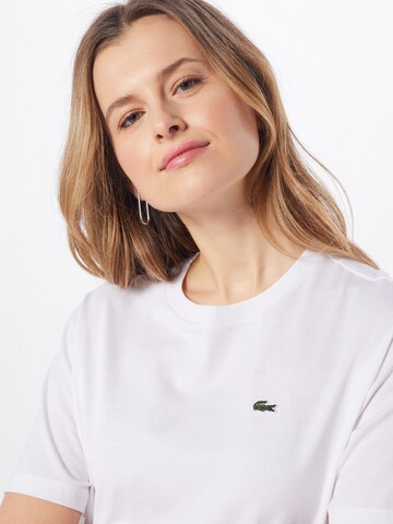 LACOSTE T-shirt i vit