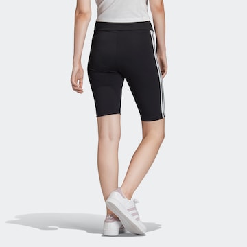 Slimfit Leggings di ADIDAS ORIGINALS in nero