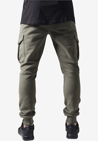 Tapered Pantaloni cu buzunare de la Urban Classics pe verde