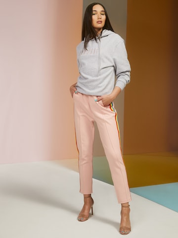 ABOUT YOU x Riccardo Simonetti Tapered Pants 'Robin' in Pink: front