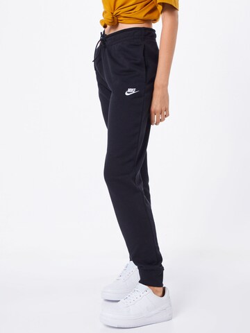 Nike Sportswear Tapered Pants in Black: front