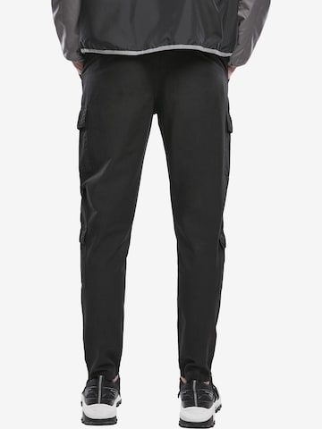 Slimfit Pantaloni cu buzunare de la Urban Classics pe negru