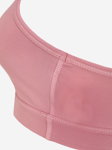 Bustino Reggiseno sportivo '4Keeps' di PUMA in rosa