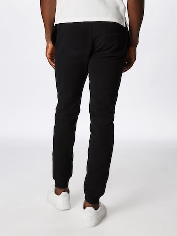 Tapered Pantaloni sport 'Ovest' de la ELLESSE pe negru