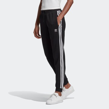 Tapered Pantaloni ' Cuffed' di ADIDAS ORIGINALS in nero: frontale