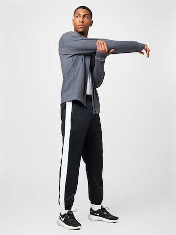 Effilé Pantalon de sport 'STARTING 5' NIKE en noir