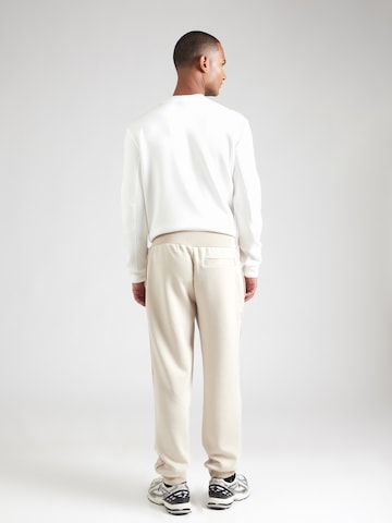 GUESS Tapered Παντελόνι φόρμας 'RYOTA' σε καφέ