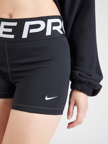 NIKE Skinny Sports trousers in Black
