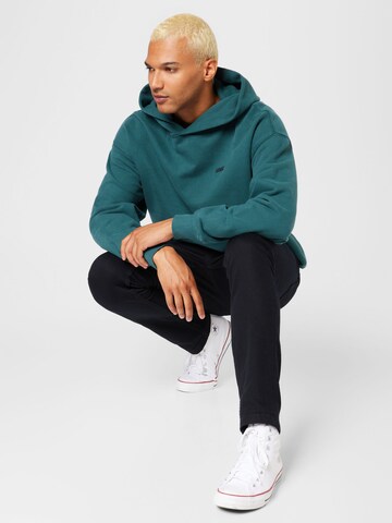 LEVI'S ® Sweatshirt 'Gold Tab Hoodie' i grön