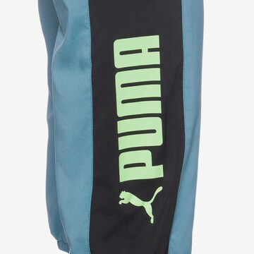 PUMA - Tapered Calças de desporto em azul