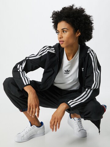 Geacă de primăvară-toamnă de la ADIDAS ORIGINALS pe negru