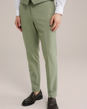 Tapered Pantaloni con piega frontale di WE Fashion in verde: frontale