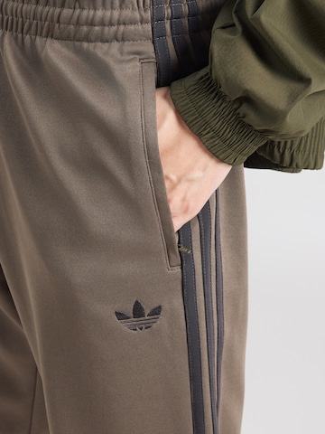 Tapered Pantaloni 'SST' de la ADIDAS ORIGINALS pe maro