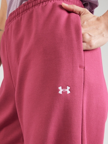 UNDER ARMOUR - Tapered Pantalón deportivo 'Icon Flc' en rojo