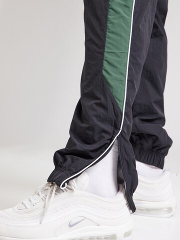 Loosefit Pantalon 'AIR' Nike Sportswear en noir