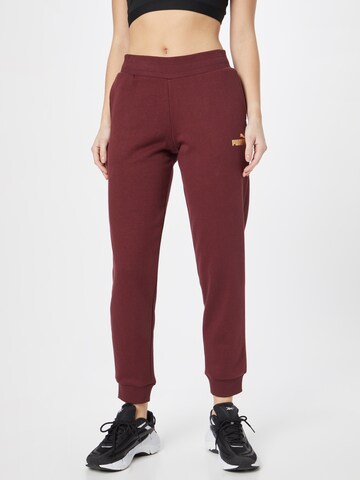 PUMA Tapered Sportbroek in Lila: voorkant