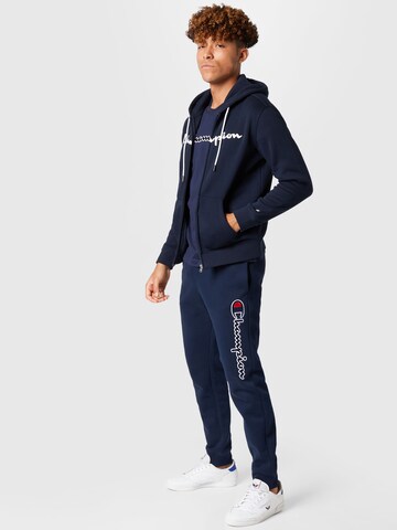 Champion Authentic Athletic Apparel Zwężany krój Spodnie w kolorze niebieski