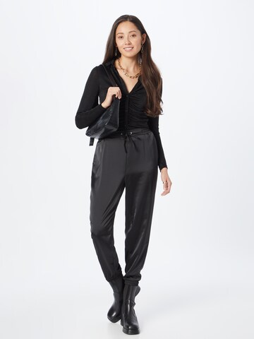 ABOUT YOU Tapered Trousers 'Ramona' in Black