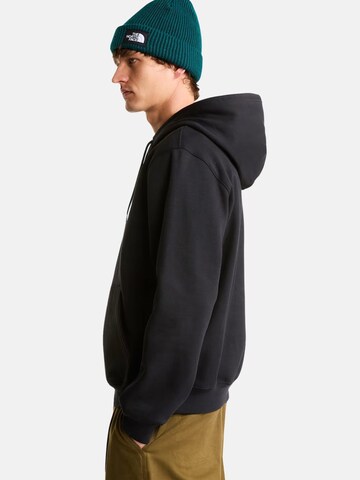 THE NORTH FACE Bluzka sportowa 'THE NORTH FACE M ESS DP REG HODDIE FELPA' w kolorze czarny