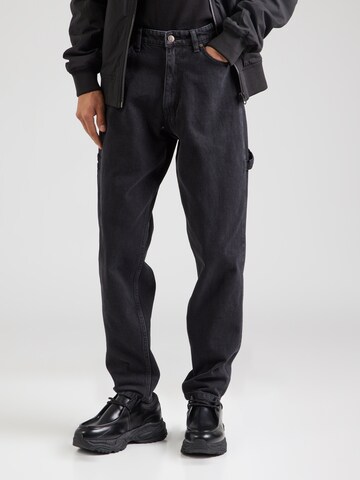 Karl Kani Tapered Jeans in Black: front