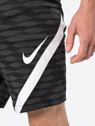 NIKE Regular Workout Pants in Black