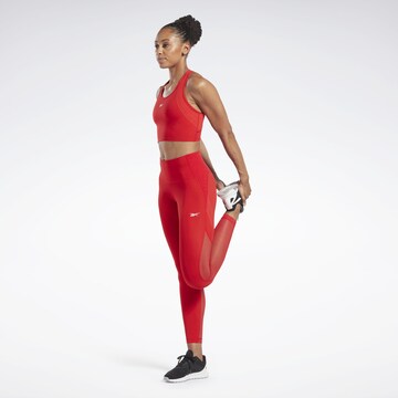 Reebok Skinny Urheiluhousut 'Lux Perform' värissä punainen