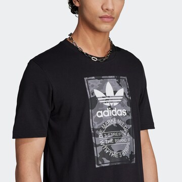 ADIDAS ORIGINALS Shirt 'Graphics Camo Tongue Label' in Schwarz