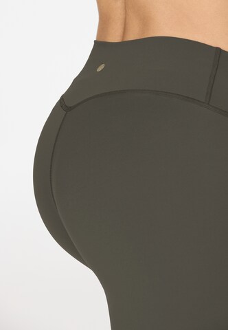 Athlecia Skinny Sportbroek 'Luxe' in Bruin