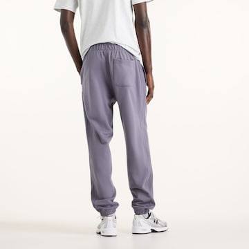 Loosefit Pantaloni 'Athletics French Terry Jogger' di new balance in lilla