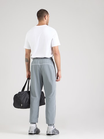 Nike Sportswear Zwężany krój Spodnie 'AIR' w kolorze szary
