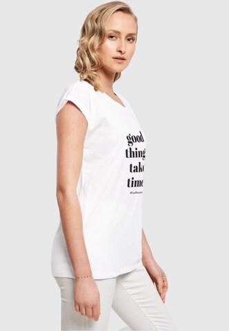Merchcode T-Shirt 'Good Things Take Time' in Weiß