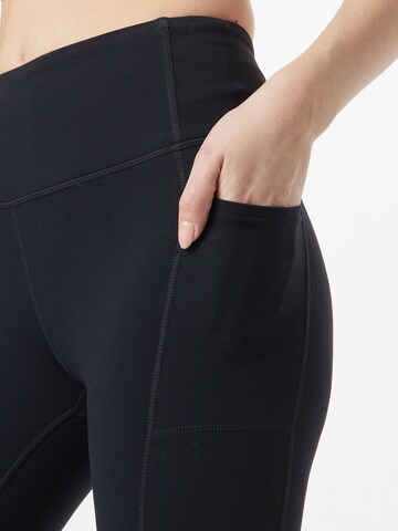 Skinny Pantaloni sport de la SKECHERS pe negru