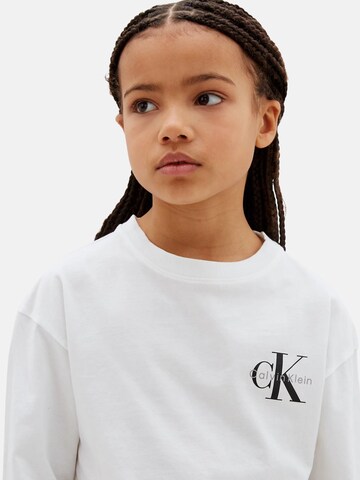 T-Shirt 'CALVIN KLEIN  JEANS kids SMALL CHEST MONOLOGO LS T-SHIRT T-SHIRT' Calvin Klein Kids en blanc