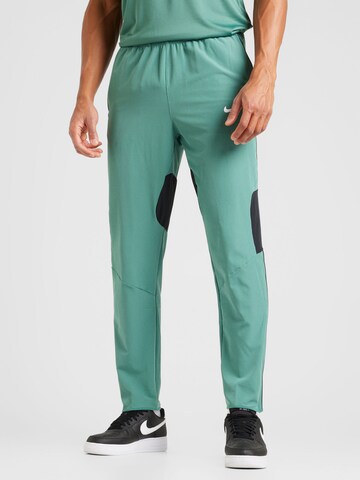 NIKE Loosefit Sportovní kalhoty 'Advantage' – zelená: přední strana