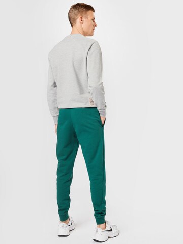 Effilé Pantalon de sport Superdry en vert